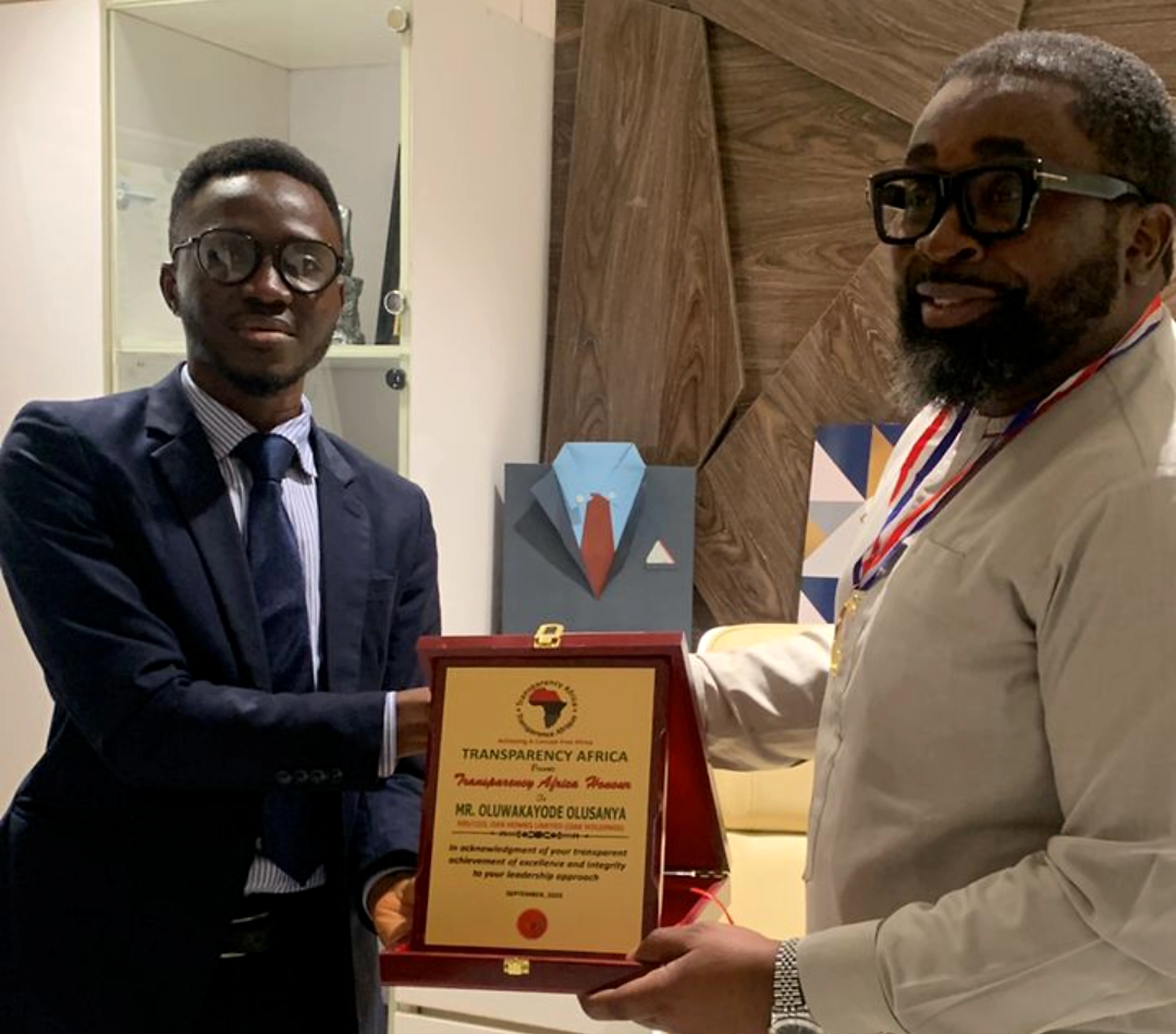 Olukayode Olusanya receiving the Transparency Africa award